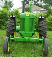 tractor with adjustable wide front end