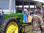 Belt work demonstration using a John Deere tractor and mill
