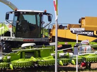 Claas harvester and Cat Lexion combine at Farm Technology Days