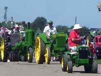 John Deere tractors in the Little Log House parade