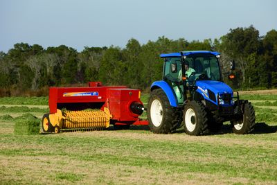 New Holland T4.75 PowerStar tractor with hay baler