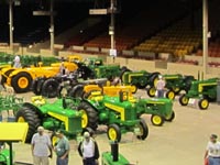 John Deere tractors and equipment on display in the Hipprodrome for Expo XXIV.