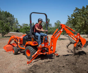 Kubota BX23S compact backhoe-loader tractor.