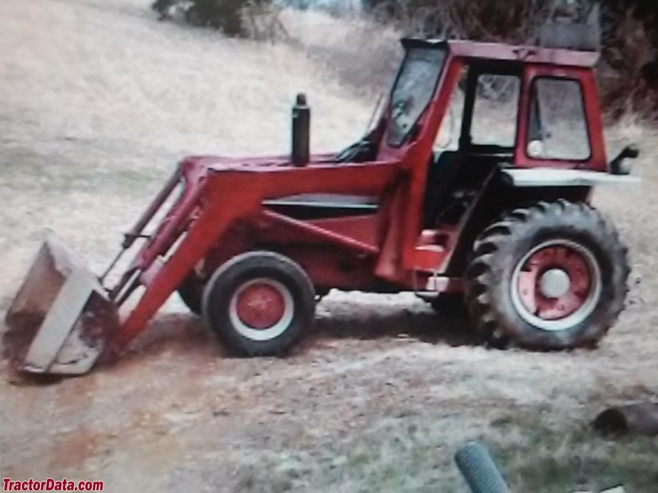 International 2500B with cab and front-end loader.
