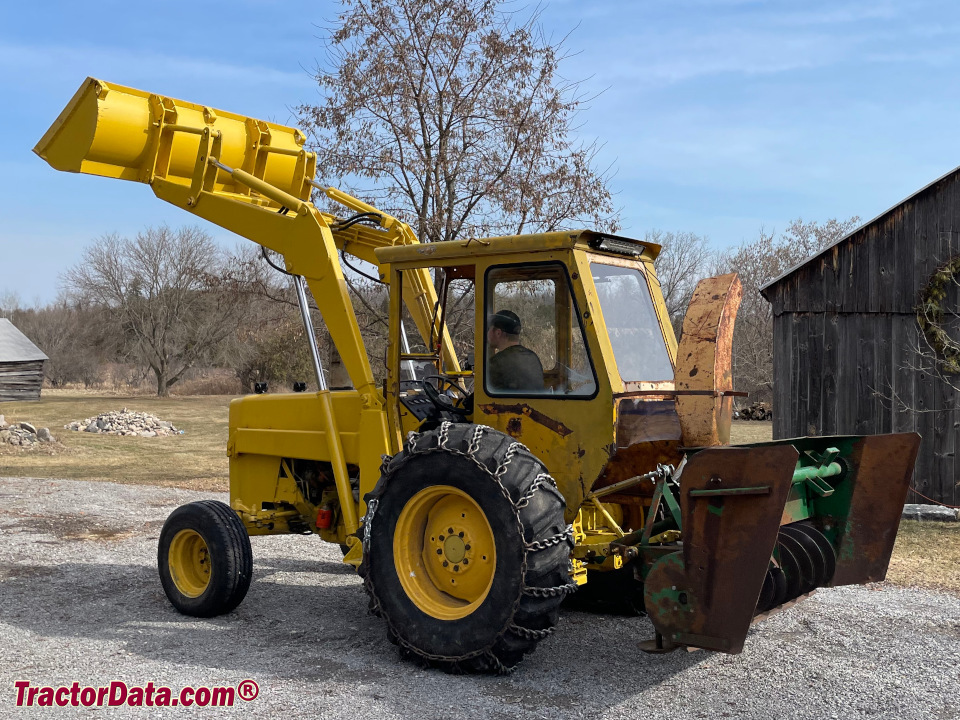 Massey Ferguson 50C industrial tractor with loader, snowblower, and after-market cab.