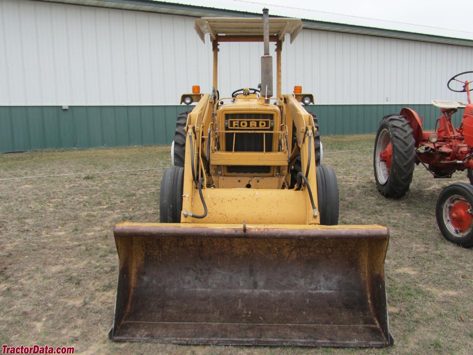 Ford 340 with front-end loader and rear blade.