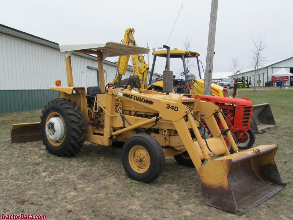 Ford 340 with front-end loader and rear blade.