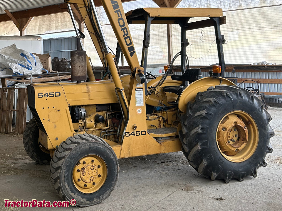 Ford 545D industrial loader tractor with ROPS.