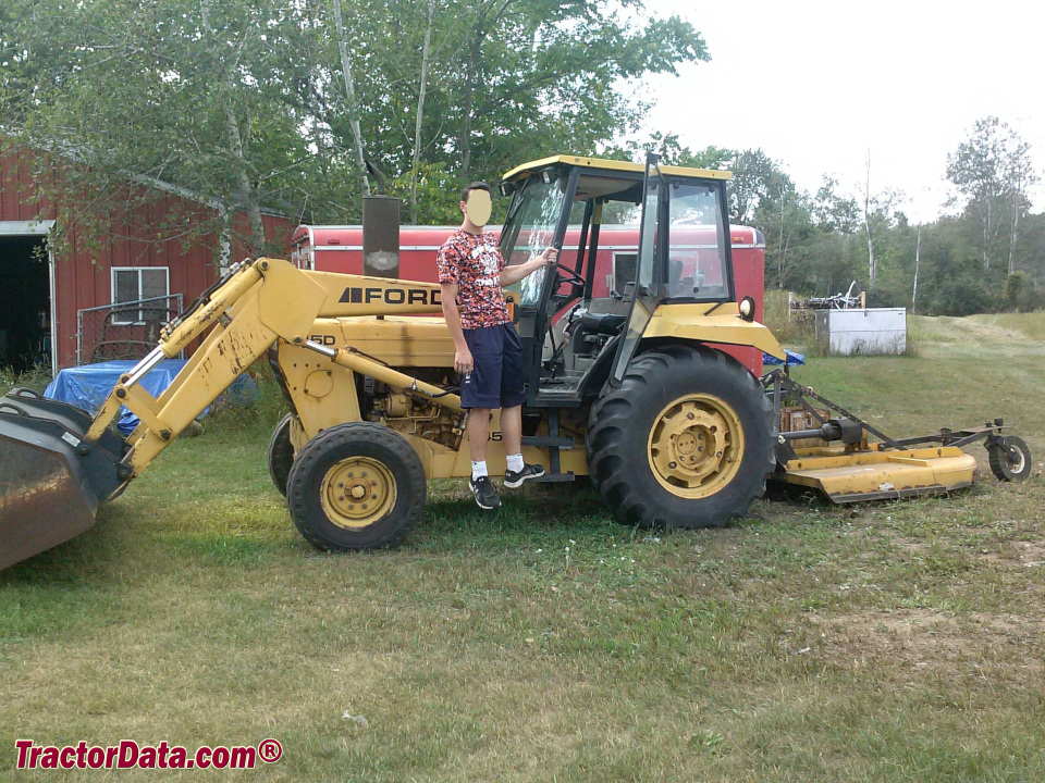 Ford 545D industrial loader tractor with cab, left side.