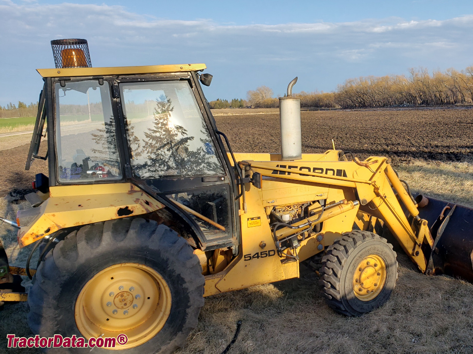 Ford 545D industrial loader tractor with cab, right side.