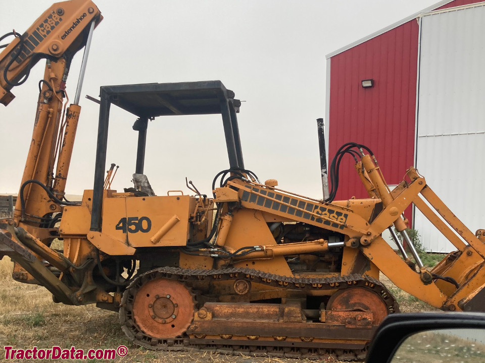 Case 450 track loader with Extend-a-hoe backhoe and four-way bucket.