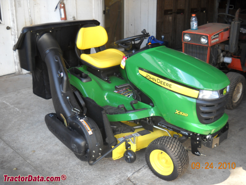 John Deere X320 lawn tractor with bagger.