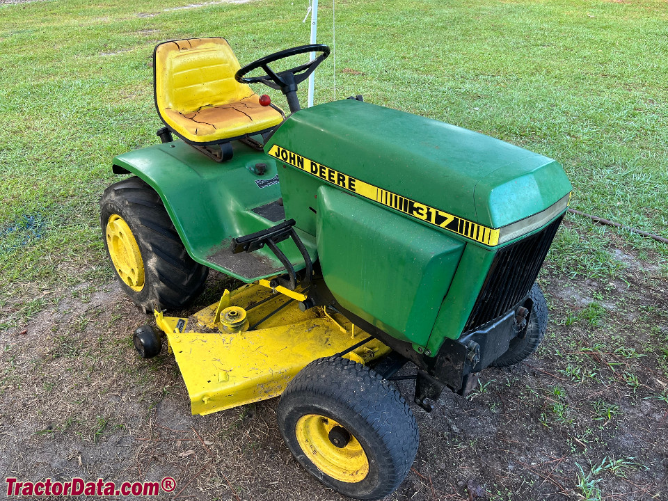 John Deere 317 with mower deck, right side.