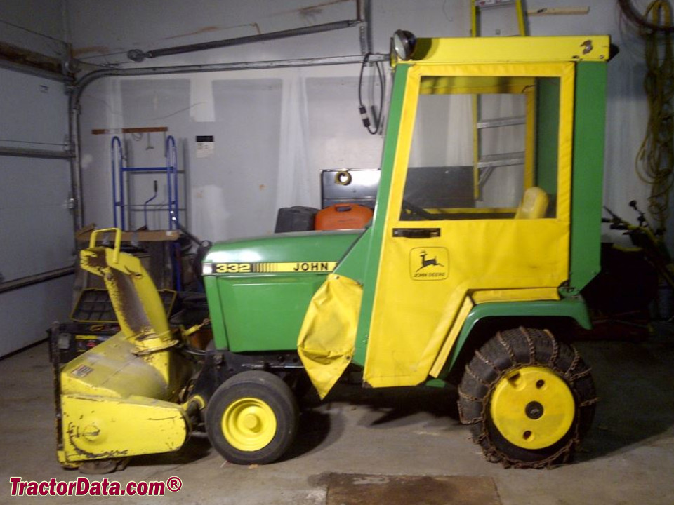 John Deere 332 with cab and snowblower.