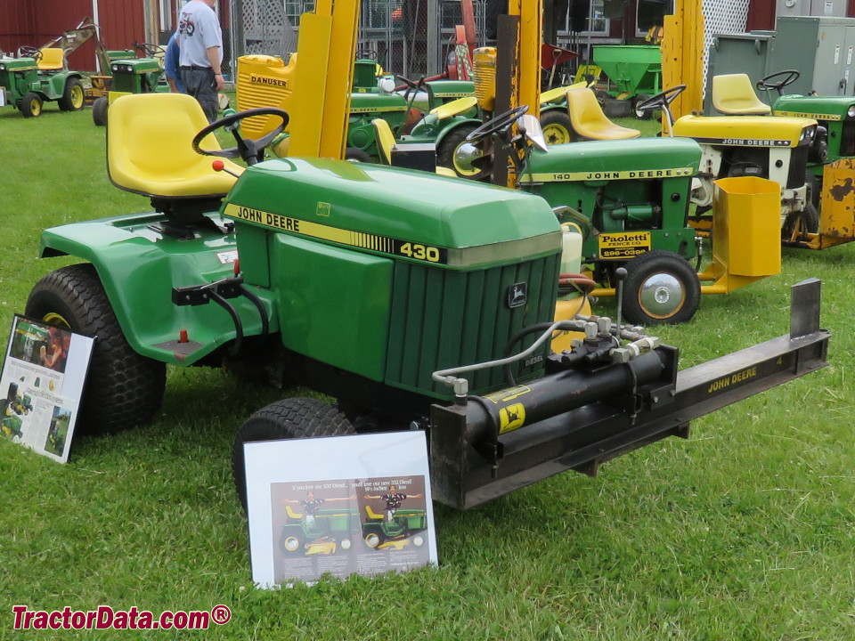 John Deere 430 with front-mount hydraulic log splitter.