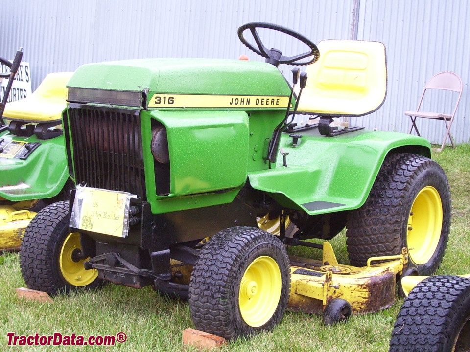 John Deere 316 garden tractor with mower deck, left side.