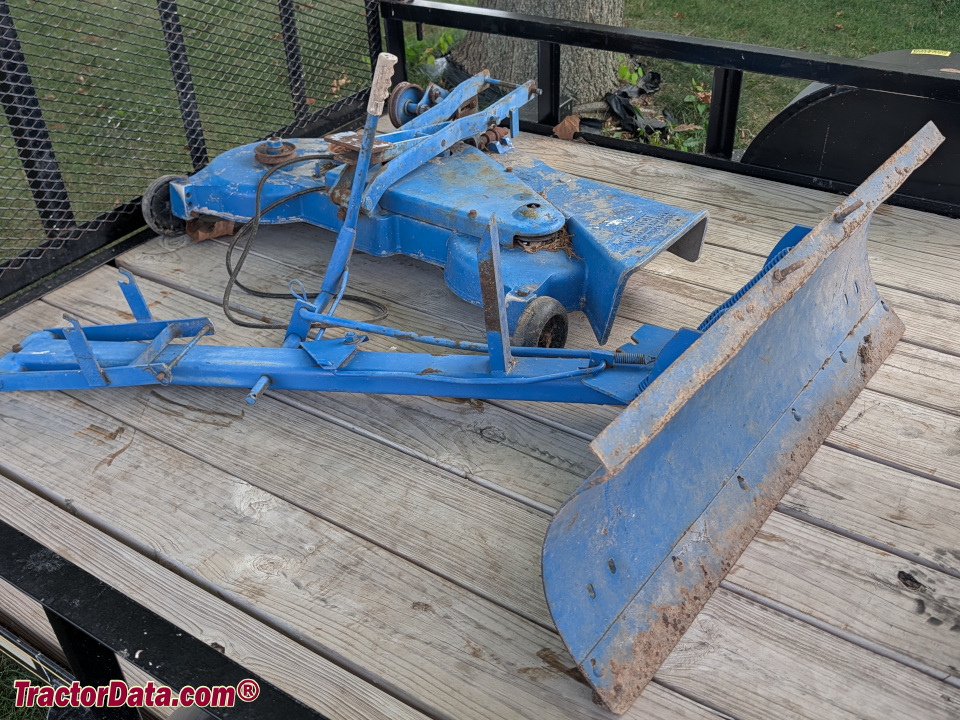 Ford LGT front blade and 48-inch mower deck.