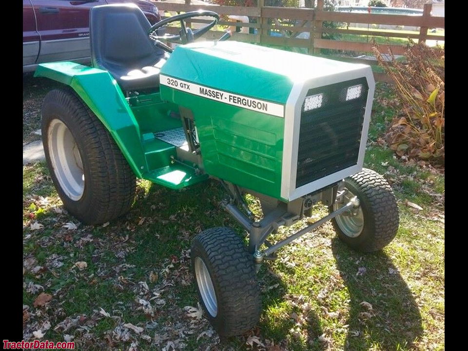 Massey Ferguson 320GTX garden tractor with custom paint and headlights.