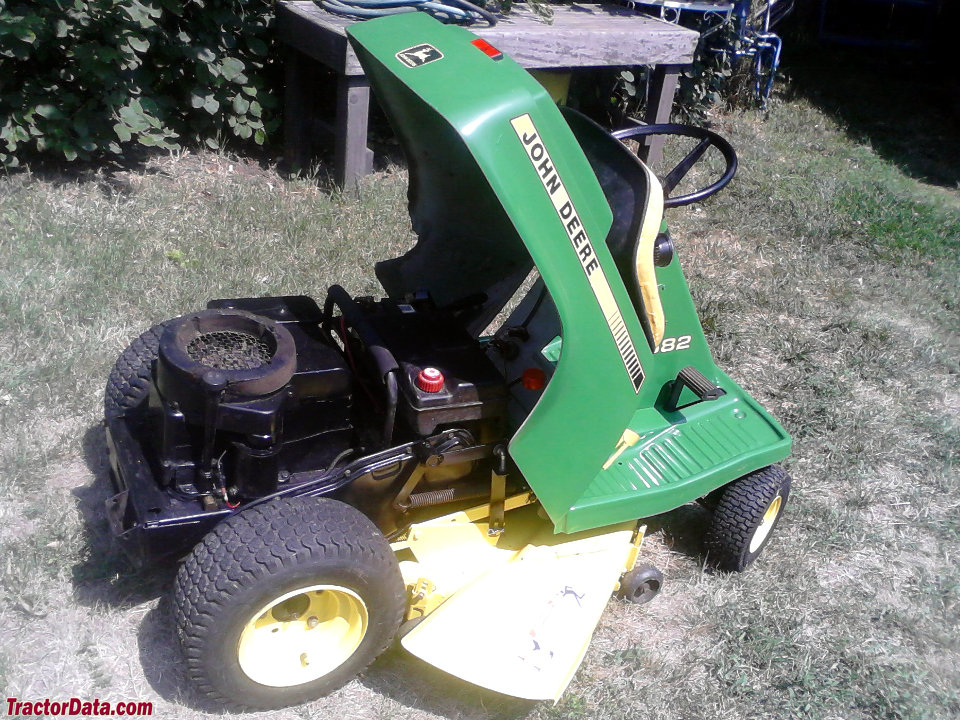 John Deere S82 riding mower with fender raised, showing the engine.