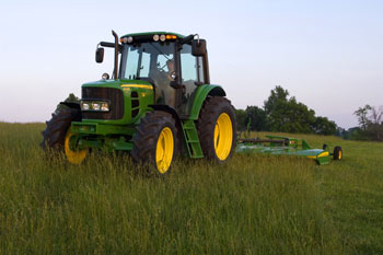 John Deere 6030 tractor with mower