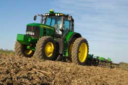 John Deere 7430 tractor with disc