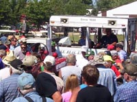 The crowd bids on a Farmall H restored by the local FFA.