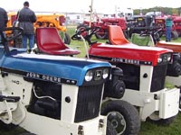 Restored John Deere patio series tractors.