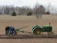 Deere GP plowing