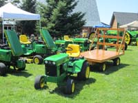 Deere 332, 112, 140 H1, 110, and John Deere 140 H3 with miniture hay wagon.