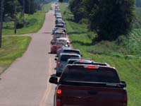 Long line of cars for the Little Log House show on Saturday