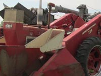 International 234 corn picker mounted on a Farmall M.