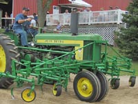 John Deere 520 with mounted cultivator.