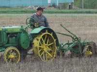 John Deere GP plowing