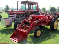 MH Colt with loader and a MF 1130