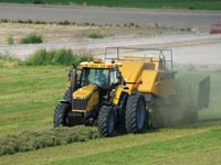 Challenger MT500D series tractor baling hay
