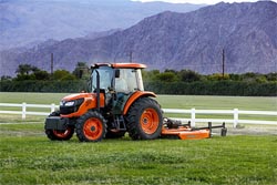 Kubota M7060 tractor with rotary cutter