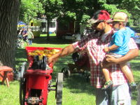 Belt-driven corn sheller demonstration.