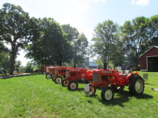 Row of Allis-Chalmers tractors at the Cedar Lake Farm Park.