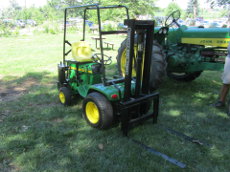 John Deere 140 with Johnson Forklift attachment.