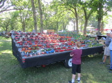 Display of over 100 farm toys.