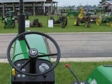 John Deere tractors and equipment on display.