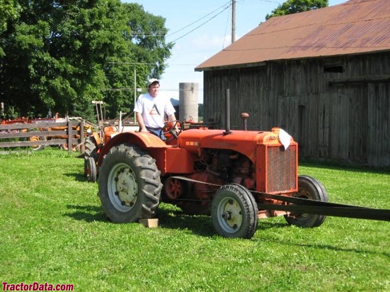 1939 Allis-Chalmers model A running a threshing machine.