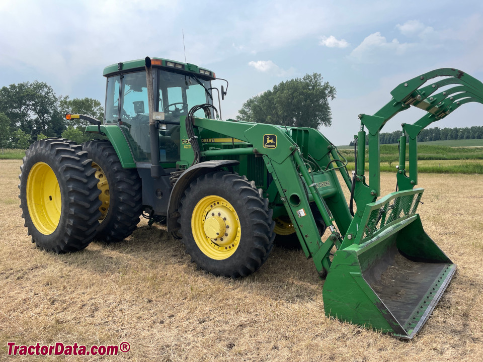 John Deere 7810 with duals and model 740 front-end loader.