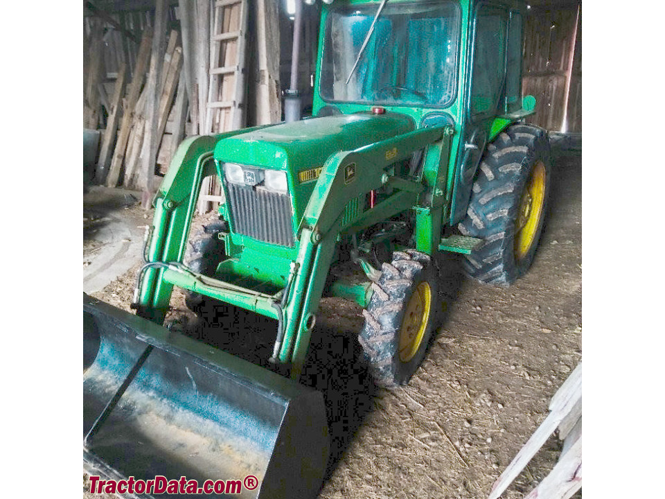 John Deere 1050 tractor with cab and model 75 loader.