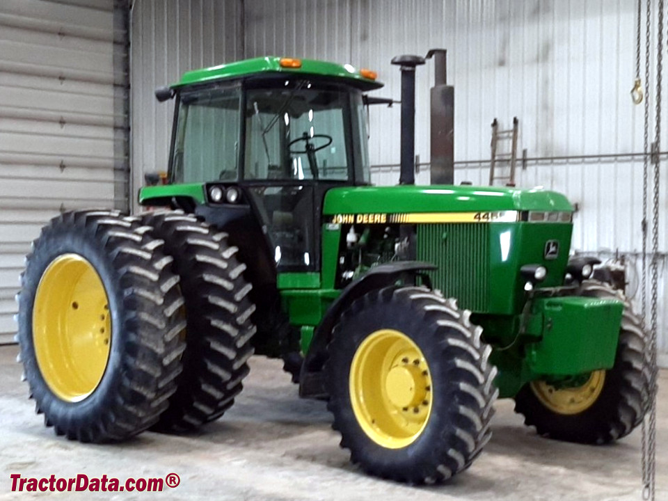 John Deere 4455 tractor with four-wheel drive and duals, left side.