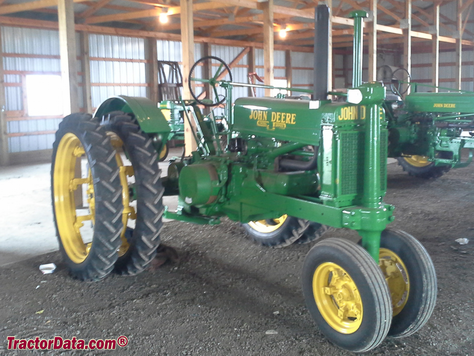 Unstyled John Deere model A with dual rear wheels.