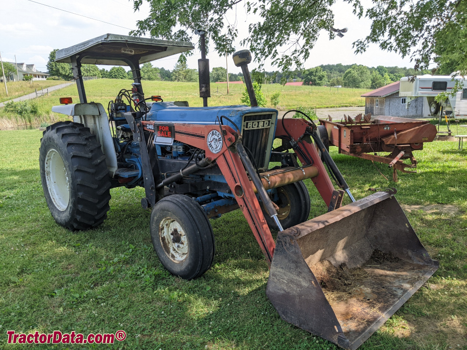 Ford 5900 utility tractor with Bush Hog front-end loader.