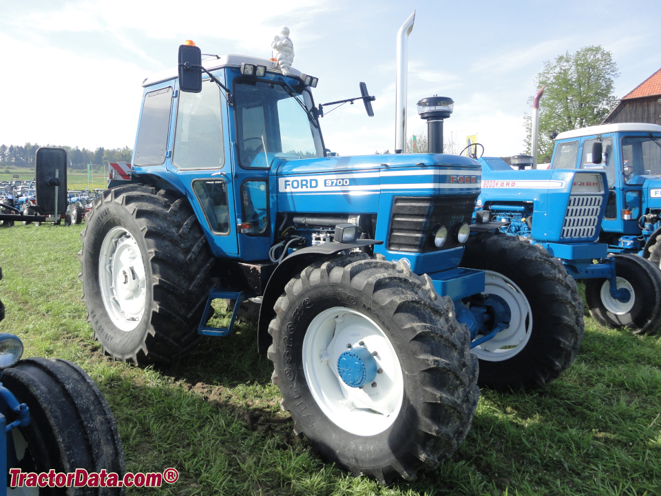 Ford 9700 row-crop tractor with four-wheel drive, right side.