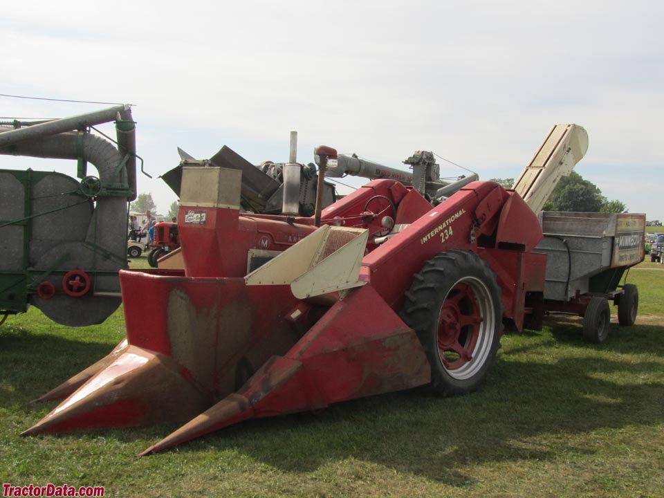 Farmall M with International 234 mounted corn picker with M & W Super Snoot.