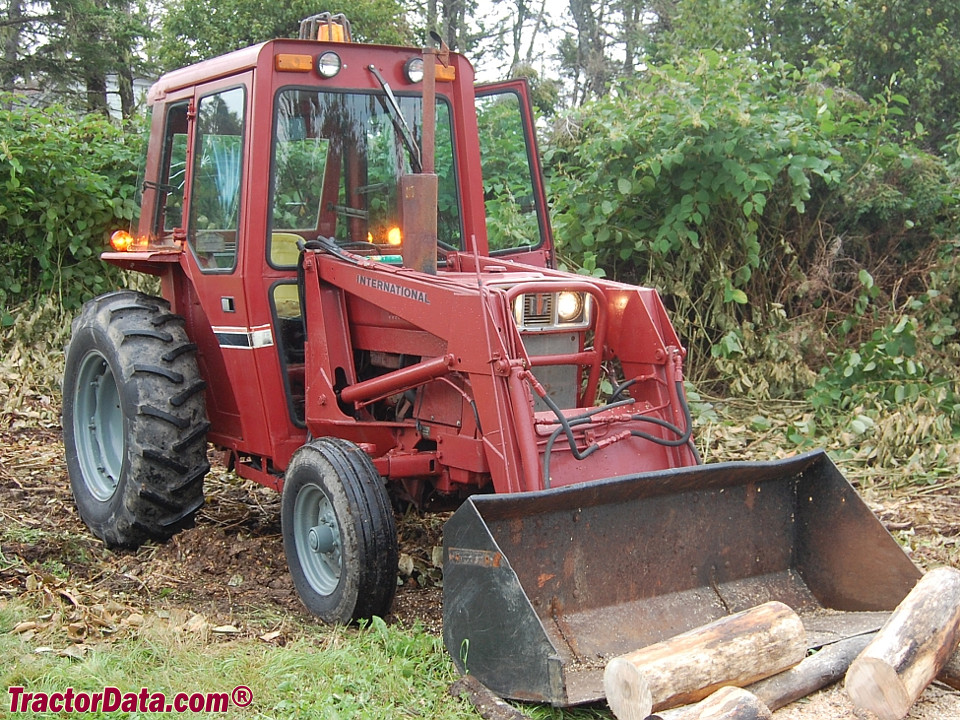 International 484 with Simms cab and model 2200 front-end loader.